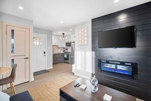 Beautiful living room area with Smart TV and indoor fireplace!