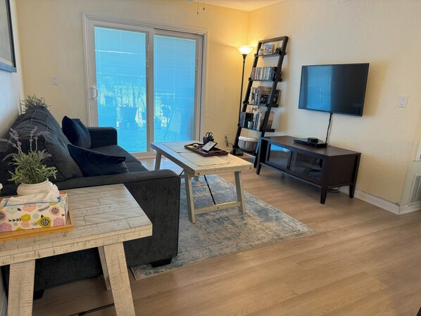 Living Room with Sleeper Bed Couch with Roku TV Mounted