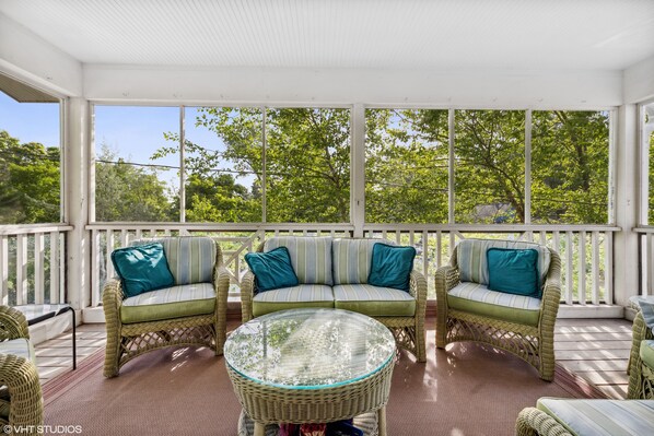 Relax and enjoy on the secluded spacious screened porch on second floor