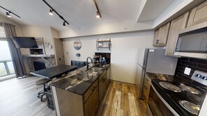 "Indoors","Kitchen","Refrigerator","Sink","Cooktop"