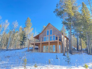 The Happy Husky Hideaway features beautiful woodland views from every window