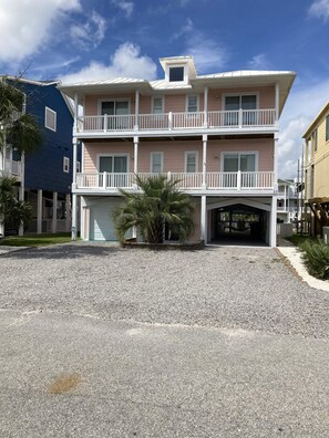 Street side. Great parking.  Room for boat trailer.  Covered decks.