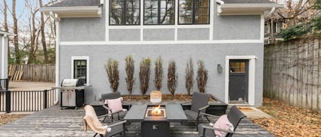 Patio space with fire table and grill