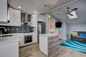 Newly renovated modern kitchen with stainless appliances.
