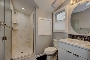 Gorgeous modern bathroom equipped with all amenities and soaps and hair dyer
