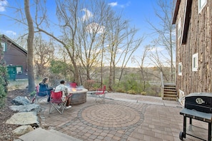 No time like fall for a cozy fire! Custom patio with beautiful landscaping.