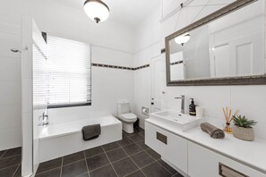 Large Bathroom with laundry (washing machine, dryer, sink)