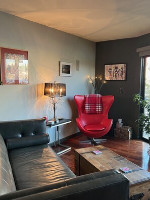 Leather mid century modern chair and couch. Motorized remote control blinds.