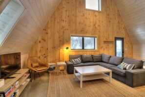 Open living room with large wrap around couch