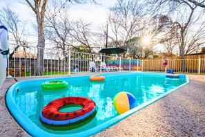 Soak the sun in our expansive backyard oasis, featuring a private pool to relax.