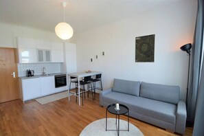 Full equipped kitchen with dinning table for your stay to cook some meals.
