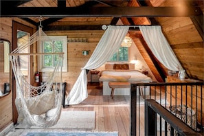 Upstairs floor is open with curtains for privacy.