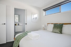 Main Bedroom King Bed, TV, and ensuite. All linen is of the highest quality and professionally laundered.