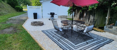 Outdoor patio with gas grill and fire pit