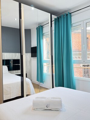 Bedroom 2 - Bedroom has a comfortable double bed with one towel per guest, air conditioning, television and storage space for your belongings. 