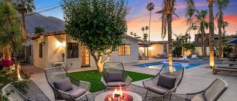 Enjoy the backyard oasis and fire pit