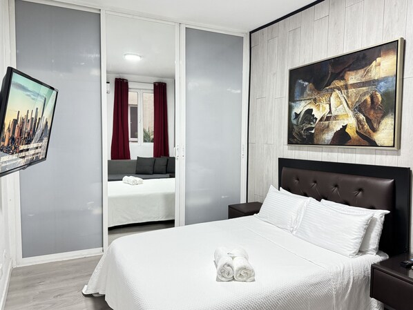 Bedroom 3 - The room has a comfortable double bed and a sofa bed, storage space, television and air conditioning.