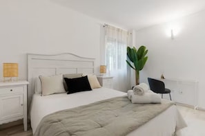 Comfortable master bedroom with a comfortable double bed and storage space.