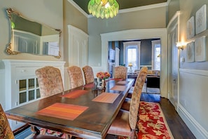 Large dining room with seating for 8+. Additional chairs stored in the kitchen.