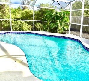 The pool are is fully enclosed and screened with private fence