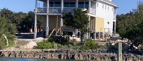 View of house while pulling away by boat