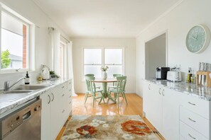 Bright Kitchen with microwave, fridge, new oven & Smeg appliances 