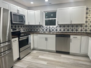 Kitchen with SS appliances. 