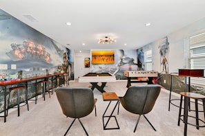 Epic game room: Dive into action with sci-fi walls and cool fun!