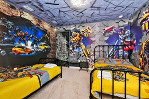 Transform your dreams in this epic bedroom! Bold robot murals and dynamic decor fuel adventure every night.