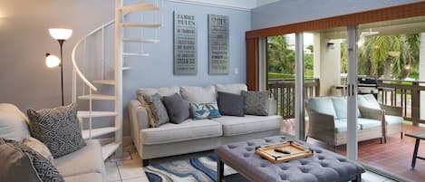 Comfortable living room which leads out to the large balcony overlooking the beach