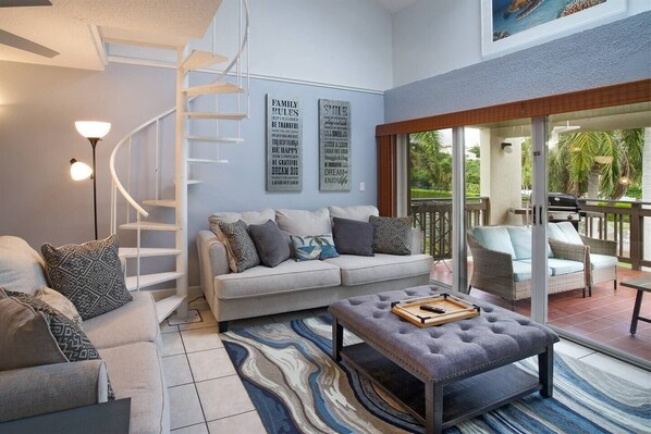 Comfortable living room which leads out to the large balcony overlooking the beach