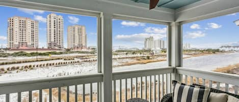 Relax on your private balcony overlooking the resort ponds with the Gulf of Mexico in the distant