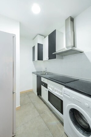 The kitchen is equipped with the main appliances, crockery and other usual utensils.