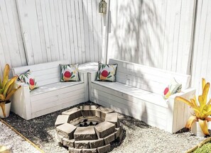Fire pit and bench seating. Firewood and fire-starting equipment are all provided.