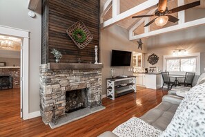 Beautiful living room with fireplace and plenty of leather seats and couch