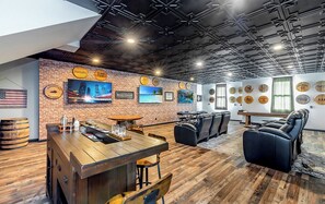 Raise a glass in this ultimate bourbon bar game room where luxury meets entertainment. Enjoy the authentic atmosphere with bourbon barrels from local distilleries. Enjoy poker, shuffleboard an