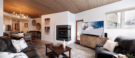 Main Living and Dining Space - TV and Deck access.
The fireplaces in the main living space and the master bedroom are not operational (they have battery operated candles in them).