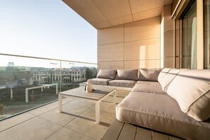 Spacious outdoor lounge with plush seating, perfect for enjoying sunsets and city views. Direct bookings: www.arcaproperties.lu