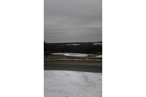 The football field during the first snowfall of the year. 