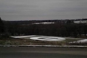 The football field during the first snowfall of the year.