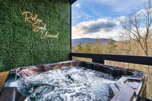 Relax in the seven person hot tub with friends and family after a day of exploring