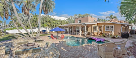 Decked Out on Marbury - a SkyRun Sarasota Property - Backyard Oasis - Private backyard with pool, fire pit and outdoor seating.