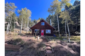 red door cabin front yard.