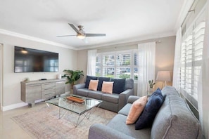 Unit 1 (1 bedroom unit) includes a living room with a full size pull out couch and a 65" TV with Netflix and Prime!