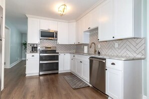 Double oven, microwave, dishwasher, fridge, air fryer, blender, toaster, coffee