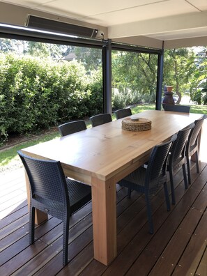 Outdoor undercover area off The Studio with weatherproof blinds and heating
