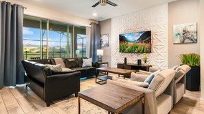 Spacious living room area with cozy sofa, perfect for a family reunion