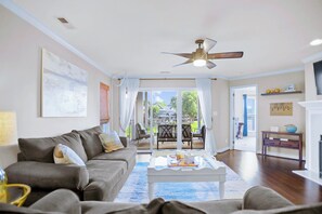 Living area with comfy seating and sliders to the deck.