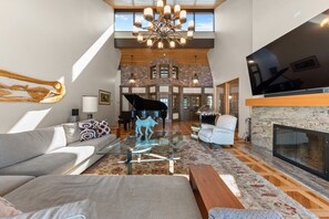 Unwind in style in our spacious living room, where modern comfort meets classic elegance. Natural light floods in, creating a warm and inviting atmosphere. Perfect for relaxing with loved ones or entertaining guests.