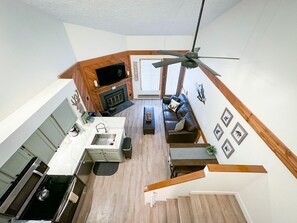 Looking down to the living area from the upper loft.